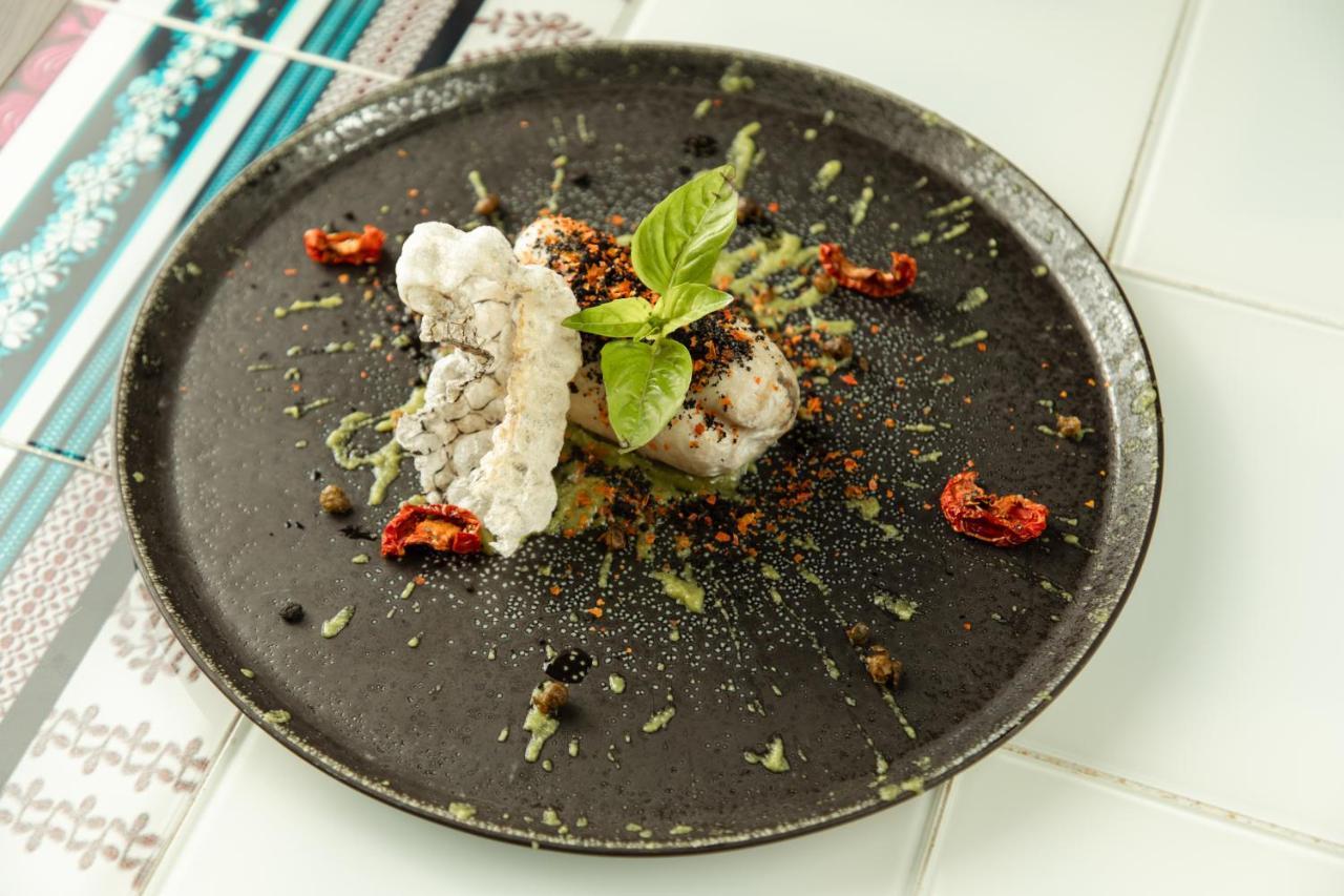 Hyatt Regency Tashkent Hotel Exterior photo A plate of raw monkfish